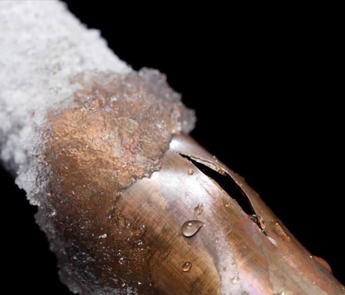 A frozen pipe that has burst